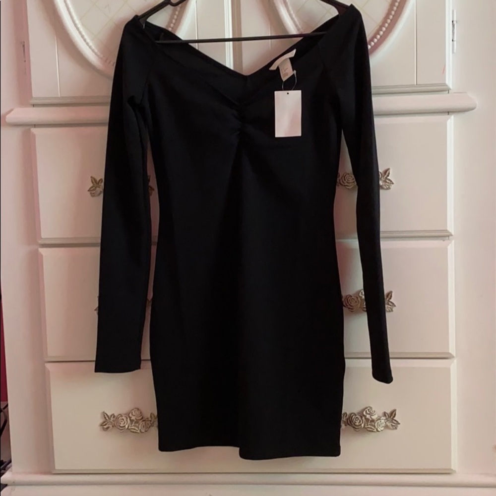 Off the shoulder form hugging dress